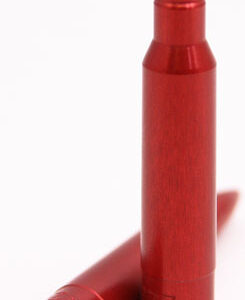 Two red lipstick bullets in a white studio background, one standing upright and the other lying on its side, showing the pointed tip.