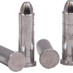 Five metallic ammunition cartridges on a white background, some standing upright and some lying down.