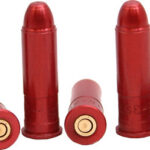 Five red shotgun shells arranged on a white background, with some standing upright and others lying down.
