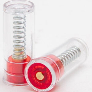 Two transparent capsules with metal springs and red bases on a white surface, shown in close-up.