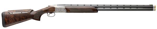 Side view of a double-barrel shotgun with a carved silver receiver and dark wooden stock.