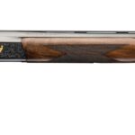 Side view of a double-barrel shotgun with a polished wooden stock and checkered grip, featuring a small emblem on the receiver.