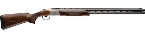 Side-by-side double-barrel shotgun with a polished walnut stock and engraved silver receiver on a white background, shown in profile.