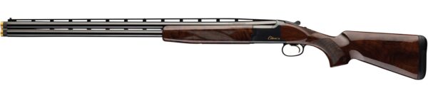 Over-under shotgun in profile with double barrels, polished wooden stock, and gold-tinted muzzle ends.