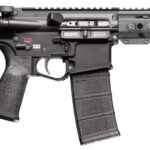 Side view of a black semi-automatic rifle with a collapsible stock, pistol grip, detachable magazine, and a long ventilated handguard with a front-mounted muzzle device.