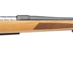 Bolt-action rifle with a light wood stock and long, black barrel viewed side-on for a sporting purpose image