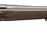 Bolt-action rifle with wooden stock and long blued barrel, shown in side profile with bolt handle visible.