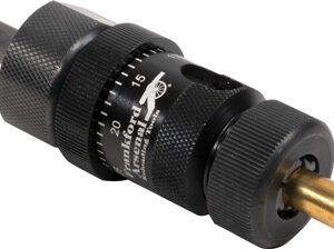 Close-up of an adjustable torque screwdriver with a knurled black metal body and brass tip holder, used to apply precise torque to fasteners.