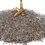 Pile of small brass bullet casings on a white background, with two upright rounds resting on top.