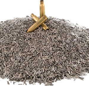 Pile of small brass bullet casings on a white background, with two upright rounds resting on top.