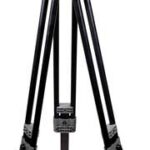 Black professional tripod with three adjustable legs and a dual-handle pan-tilt head for mounting a camera or equipment.