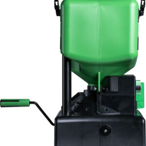 Green seed planter with a large hopper mounted on a black base and a long handle for manual operation