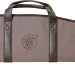 Long tan soft gun case with two carrying handles, a front zip pocket, and a dark reinforced end cap.