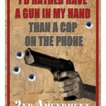 Poster-style sign with a handgun and the bold slogan: "I'd rather have a gun in my hand than a cop on the phone," and "2nd Amendment" at the bottom in a vintage aesthetic.