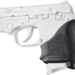 Profile view of a white M&P Bodyguard 380 semi-automatic pistol with a black textured Hogue grip.