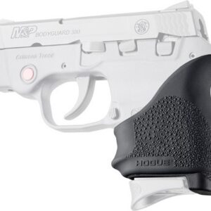 Profile view of a white M&P Bodyguard 380 semi-automatic pistol with a black textured Hogue grip.