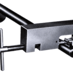 Metal bench vise with a T-handle screw for clamping workpieces.