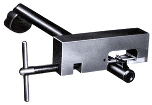 Metal bench vise with a T-handle screw for clamping workpieces.