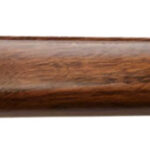 Side view of a polished wooden rifle stock with a curved butt and a sling stud on the right.