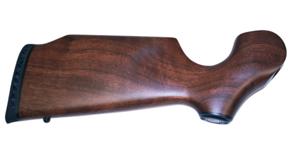 Wooden rifle stock with a textured recoil pad at the butt and curved grip area on white background