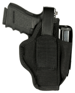 Black handgun secured in a black holster with a retention strap over the grip