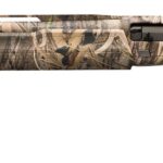 Camouflage-pattern hunting shotgun with a long barrel and black stock against a white background.