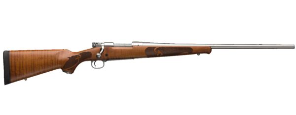 Bolt-action rifle with a wooden stock and long metal barrel, shown in profile with iron sights and intricate grip engraving on the stock edge.