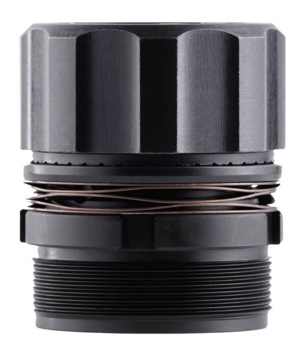 Close-up of a metal cylindrical component with a copper coil winding around the middle and a threaded bottom portion.