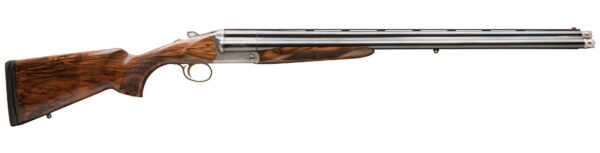 Side-by-side double-barrel shotgun with walnut stock and engraved receiver, shown in profile with metal barrels gleaming.
