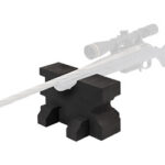 Bolt-action rifle with scope resting on a black shooting rest.