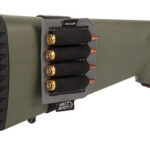 Olive-green rifle buttstock with a black rubber recoil pad and four-shell shotgun shell holders mounted on the side.