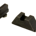 Two black plastic gun sights: a rear notch sight and a front ramp-style sight.