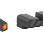 Compact red-dot micro sight with orange window beside a matching rail mount for a firearm.