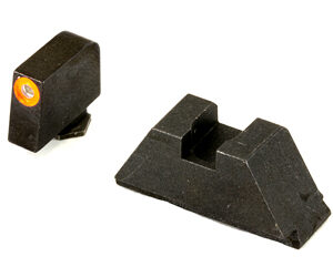 Two black plastic alignment guides with a slot, one small piece has an orange circular insert.