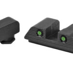 Two black gun sights: a front sight with an orange bead and a rear sight with two green fiber-optic dots.