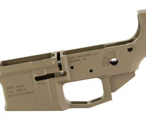 Tan AR-style rifle lower receiver component with trigger guard and magazine well, showing serial/maker markings.