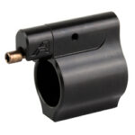 Black clamp-on firearm accessory with a circular bore and a small brass tube protruding from the side.