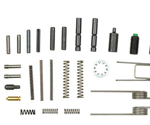 Assorted small metal hardware parts laid out: pins, springs, dowel pins, washers, bushings, threaded pieces, and U-shaped components.