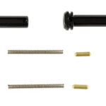 Hardware kit with two black cylindrical bolts, two long springs, and two small brass pins.