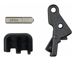 Set of small tool components: a metal key labeled APEX, a black plastic cap, and a black lever with two holes.