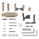 Assorted small hardware parts, including pins, springs, rods, screws, and a tan plastic component, arranged on a white background.
