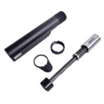 Camera cleaning kit components: a black cylindrical case, two circular clamps, and a flexible wand with a nozzle for cleaning lens elements.