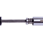 Disassembled AR-15 rifle buffer with black end cap, coiled spring, and silver cylindrical weight marked ARMASPEC