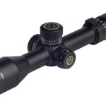 Black rifle scope with adjustable turrets and eyepiece, shown from the side against a white background.
