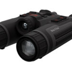 Pair of black binoculars with rubberized grips and dual lenses for viewing distant objects.