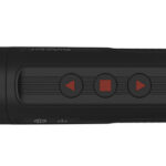 Black cylindrical portable speaker with three control buttons (rewind, stop, play) along its side.