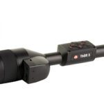 Thermal riflescope with lens cap open, THOR 5, mounted on a rail.