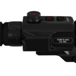 Black riflescope with variable magnification 3.5–20x, mounted on a rail, showing adjustment turrets and eyepiece