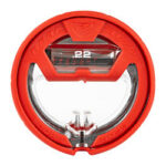 Close-up of a red circular device with a small digital display showing the number 22 and a clear center window.