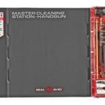 Real Avid MasterCleaning Station Handgun kit in a dark gray case with a red tool storage tray on the right, showing cleaning tools ready for use.